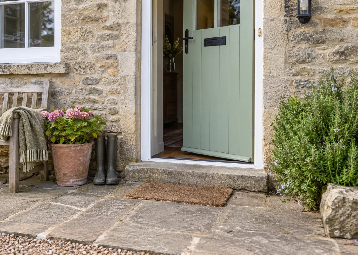 Level cottage entrance with a visible doorstep.
