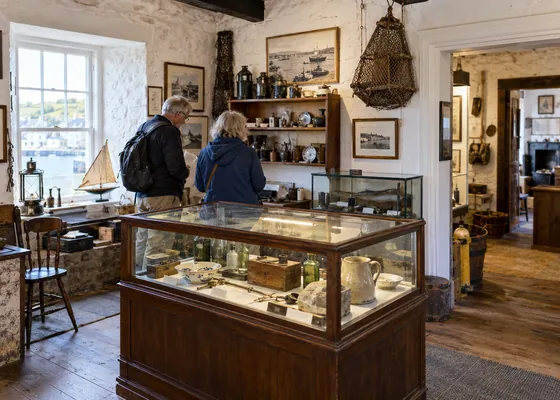 Small local history museum display of everyday historic objects.